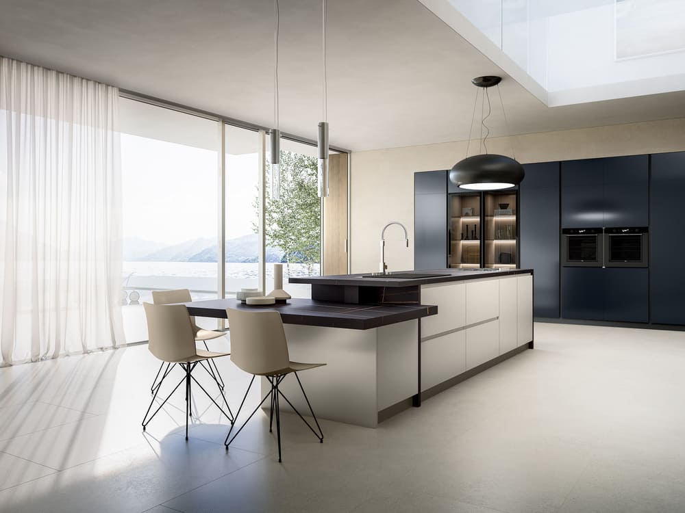 a kitchen with a island and chairs