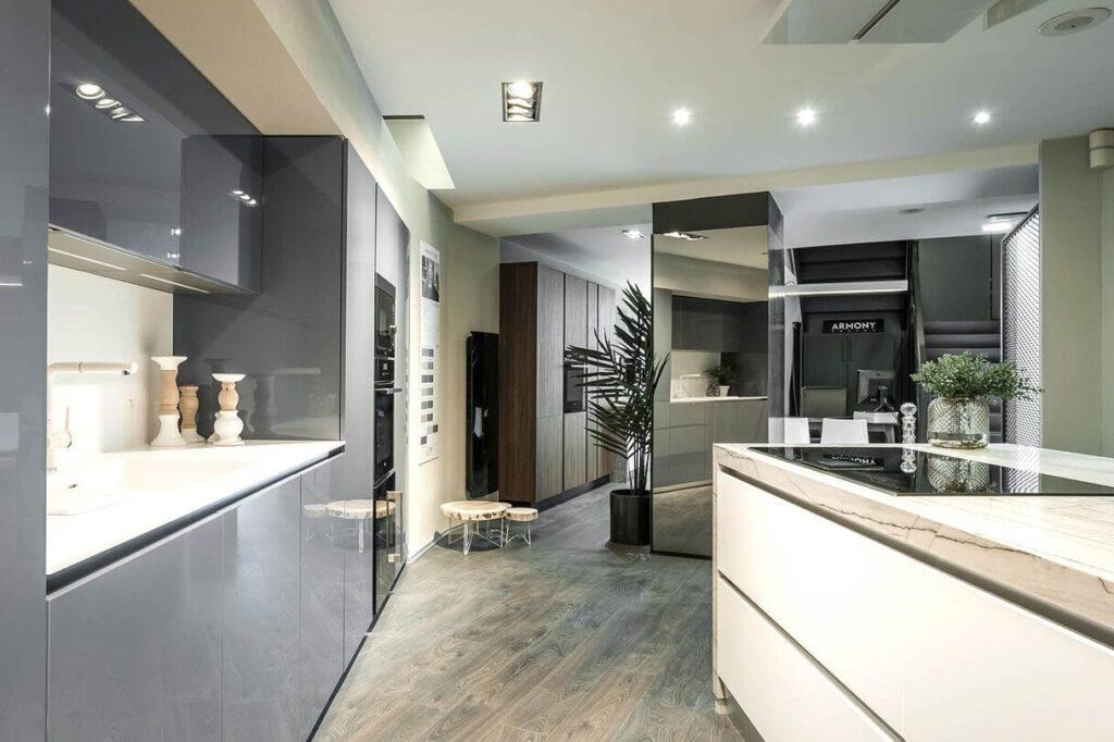 a kitchen with a wood floor and a wood floor