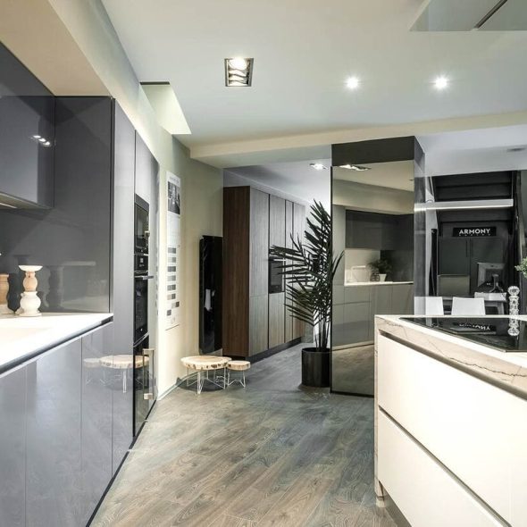 a kitchen with a wood floor and a wood floor